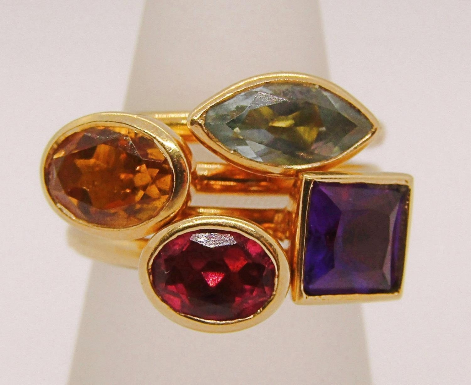 Four 18ct gem set stacking rings by Pascal Jewellery (now Annoushka), citrine, amethyst, topaz and