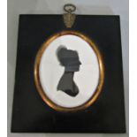 Georgian silhouette portrait on plaster labeled 'T.Birkbeck', glazed in oval frame, 8 x 6.5 cm