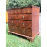 An 18th century walnut chest of three long and three short drawers with crossbanded detail, the