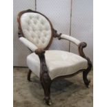 A Victorian drawing room chair with cream ground repeating leaf patterned upholstered seat with