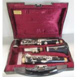A Buffet Crampon B12 Clarinet Paris in five sections in a velvet lined plastic case.