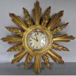 A gilded starburst clock with later applied quartz movement
