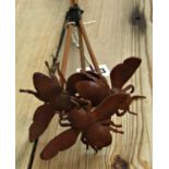 Three small ornamental steel garden border stakes with floating bee finials, 74cm high