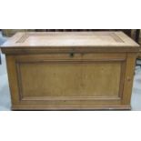 An antique stripped pine blanket box with hinged lid and moulded panelled frame 97 cm wide x 54 cm