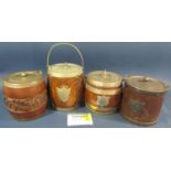 An Edwardian oak fruit bowl with china liner, and four similar oak biscuit barrels.