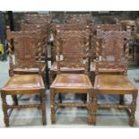 A set of 8 (6&2) Carolean style oak dining chairs with oval cane panelled backs, carved frames and