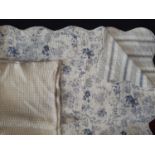 Machine made reversible quilt with toile de jouy type print on one side and contrasting stripe verso