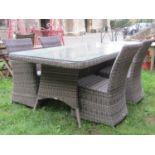 A Bramblecrest rattan garden terrace table of rectangular form with rounded corners and plate
