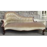 A Victorian rosewood framed chaise lounge, with scrolled detail and buttoned back on cabriole