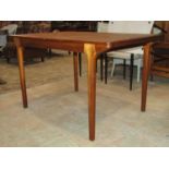 An A H Mackintosh & Co Ltd of Kirkaldy, Scotland teak pull out extending dining table with
