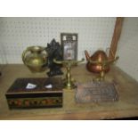 A collection of Arts & Crafts metal ware including a pair of brass fire dogs, a beaten copper letter