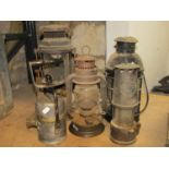 A small collection of vintage storm lanterns, miners lamps, etc to include a further vintage Shell