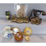 A miscellaneous collection of items including an elaborate brass desk stand, a brass vintage