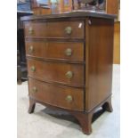 A small good quality Georgian style bowfronted chest of four long graduated drawers with shaped