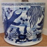 A Chinese blue and white jardinière or planter with hand painted detail of carp and crustaceans, etc