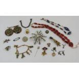 Collection of antique and vintage costume jewellery to include a white metal equestrian sport fob (