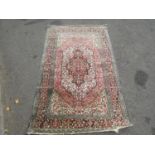 A fine silk Persian rug with an overall floral pattern, 170cm x 107cm approx