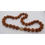 Carved coquilla nut bead necklace with 14k diamond set clasp, 61cm L approx