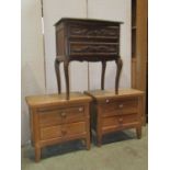 A pair of low solid oak two drawer bedside chests with fielded panelled sides, raised on square