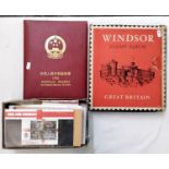 A boxed Windsor stamp album of Great Britain containing stamps dating from the 1930s, an album