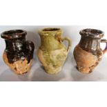 Three partially glazed earthenware jugs, 15cm high approx