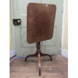 A Regency mahogany snap top occasional table the rectangular top raised on a bobbin support and