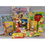 A large collection of Simpsons themed games, toys and merchandise including Monopoly ©2003 and 3D