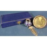A silver Winnie-the-Pooh christening spoon with original case, a small circular silver photo