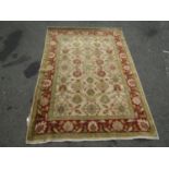 A Ziegler design carpet with floral palmettes to a fawn ground,230cm x 170cm approx