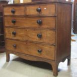 A 19th century mahogany bedroom chest of two short over three long graduated drawers, with shaped