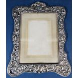 An Edwardian silver foliate vase embossed photo frame, Chester 1906, maker unknown, 30 x 23cm approx