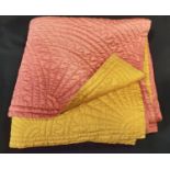 Large impressive reversible quilt in pink, with mustard on other side. Quilted with flower
