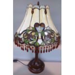 An Art Nouveau “Tiffany” style table lamp with “lead” floral panelled shade with facetted drops,