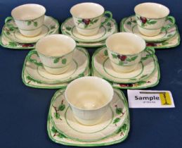 A Crown Devon tea service for six with hand painted floral detail within green banded borders,