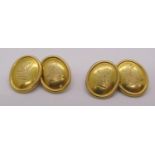 Pair of antique yellow metal cufflinks with engraved crests, 10.9g