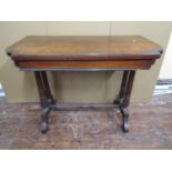 A Victorian walnut and burr walnut foldover top card table, raised on a stretcher base, supported by