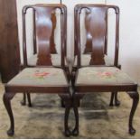 A set of four good quality Queen Anne style mahogany dining chairs with shaped splats over floral
