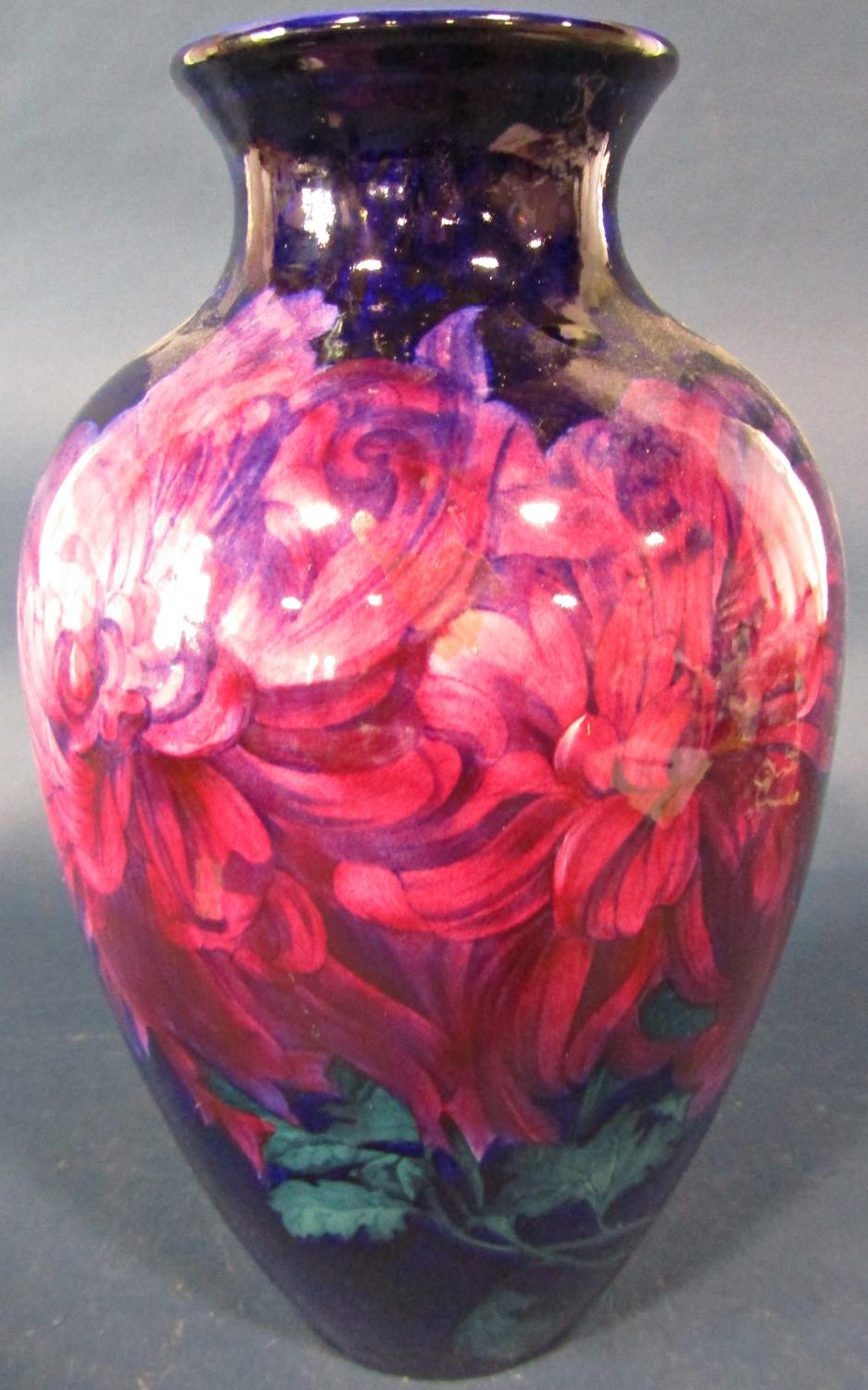 A George Jones oviform vase - Imperial Rouge, decorated with chrysanthemums on a dark blue ground