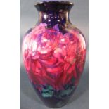 A George Jones oviform vase - Imperial Rouge, decorated with chrysanthemums on a dark blue ground