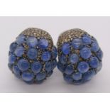 Striking pair of 18ct black gold earrings pavé set with cabochon sapphires and fancy coloured