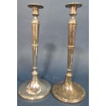 A pair of slender silver arts and crafts style Guild of Handicraft candlesticks, London 1976, with