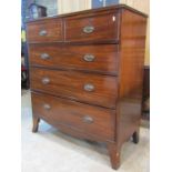 An early 19th century mahogany bedroom chest of two short over three long graduated drawers, with