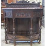 A Victorian oak breakfront side table, in the Old English style, with scrolling acanthus and further