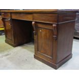 A Victorian mahogany twin pedestal sideboard fitted with three frieze drawers over cupboards