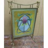An art nouveau firescreen in brass, the stylistic frame enclosing a glass bead work panel with