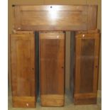 A run of four slender mahogany cupboards each enclosed by a rectangular panelled door with vacant
