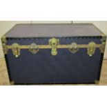 An overpond cabin trunk, together with two green painted tin trunks with drop side handles (3)