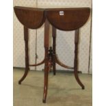 A small late Victorian mahogany occasional table, the square top surrounded by oval drop leaves