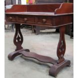 A Victorian mahogany washstand, with raised three-quarter gallery over three frieze drawers,