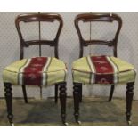 Four Victorian mahogany balloon back dining chairs with moulded frames, scrolled bar splats,